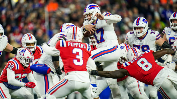 Dec 1, 2022; Foxborough, Massachusetts, USA; Buffalo Bills quarterback Josh Allen (17) runs the ball against the New England Patriots in the first quarter at Gillette Stadium.